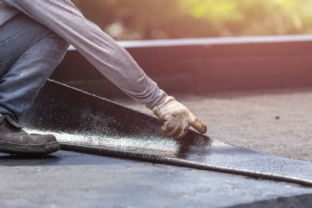 Professional Basement Waterproofing technician working in Holley, NY